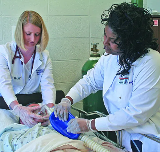 Two female doctors providing respiratory care