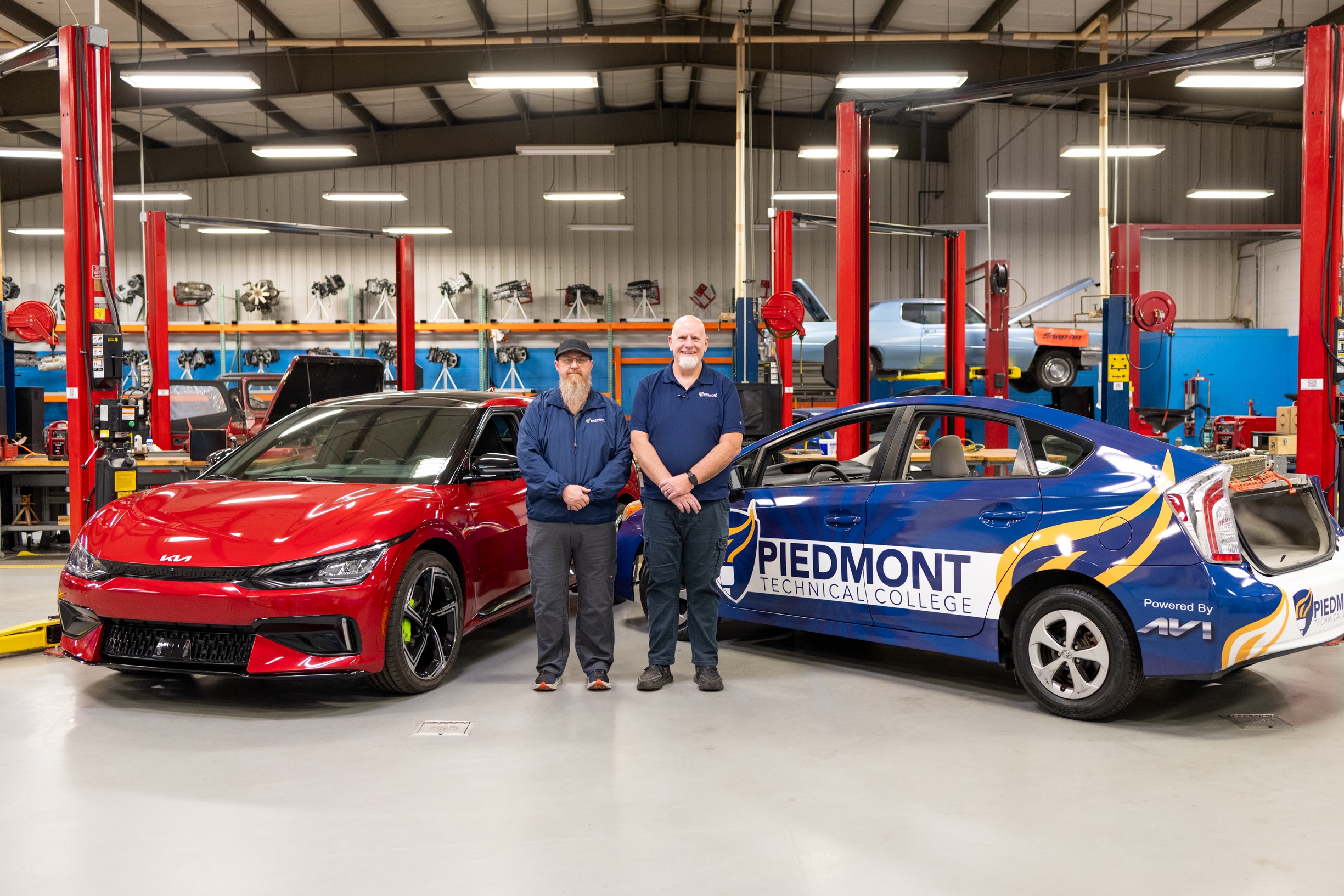 Bill and Gerald by the cars