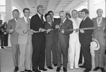 Men at ribbon-cutting ceremony