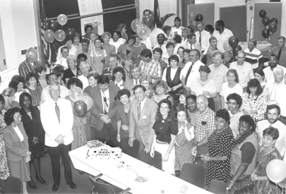 Group celebrating with cake