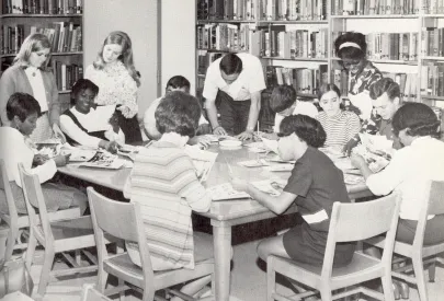 Students work together in the library on campus.