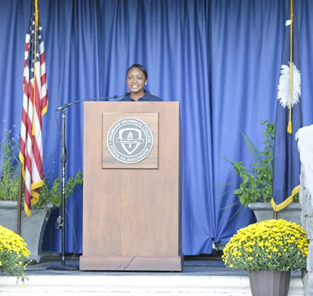 Presidential Ambassador gives speech.