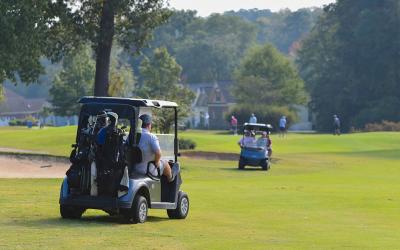 Golf carts making their way on a course