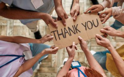 Hands holding a thank you sign