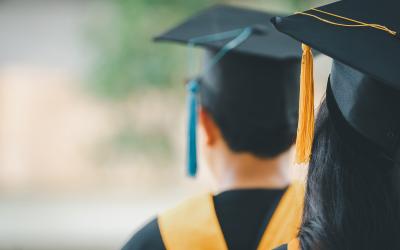 Back of a man's head in a graduation cap