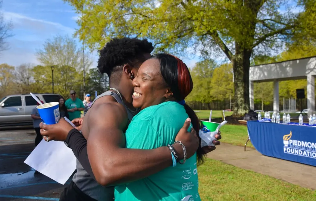A woman and a man hugging