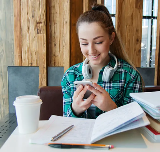 Girl face-timing and studying 