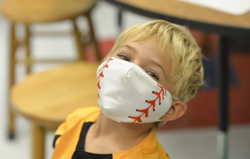 Young student with mask on