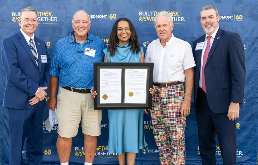 Dr. Rivers receives legislative resolutions marking PTC's 60th anniversary
