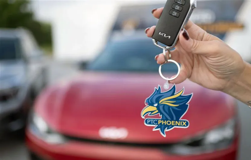 Keys with Kia EV6 in the Background