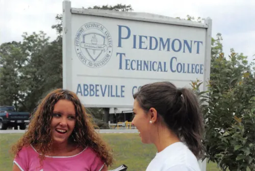 Women in front of PTC sign